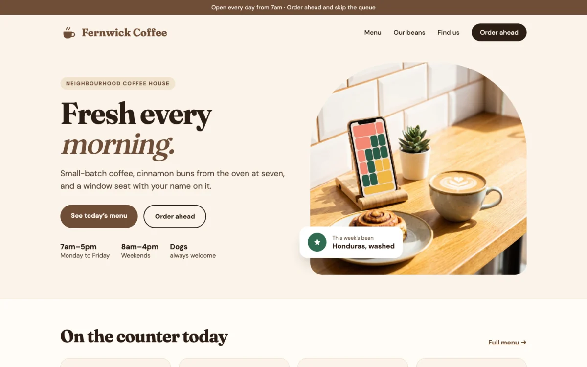 An example website for a made-up café, Fernwick Coffee, on a laptop: “Fresh every morning.”